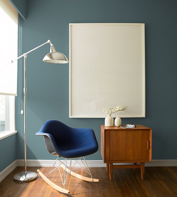 Sunlit breakfast room in Benjamin Moore Aegean Teal with natural light wood textures