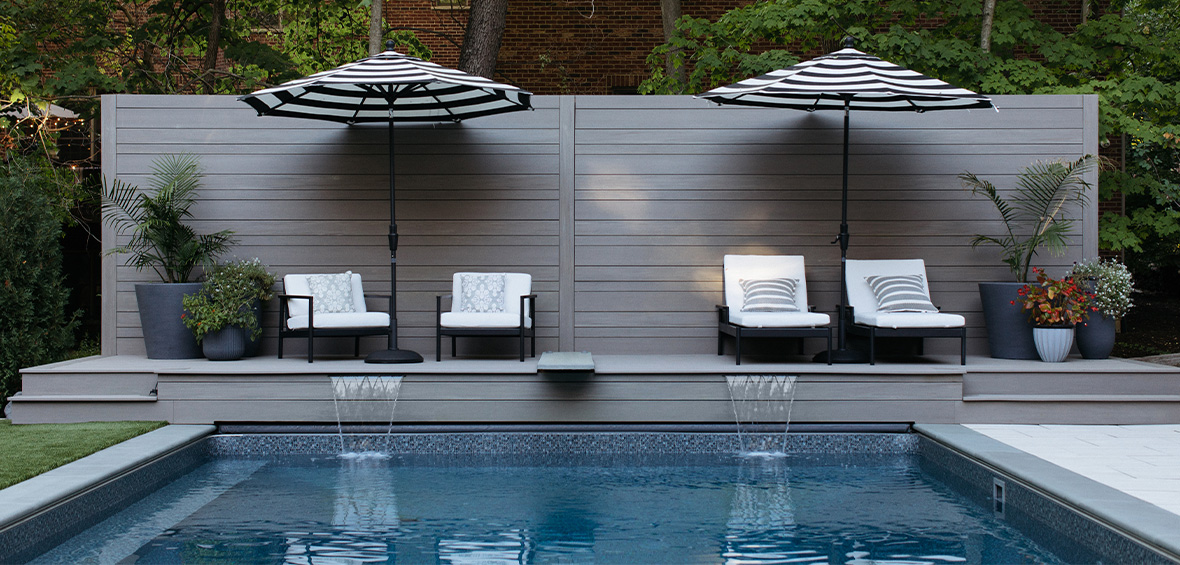 Pool deck and privacy wall in TimberTech Advanced PVC Vintage Collection in Coastline