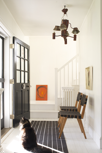 Entryway with Benjamin Moore Coventry Gray walls, stairs and trim in BM Super White; door in Black 2132-10