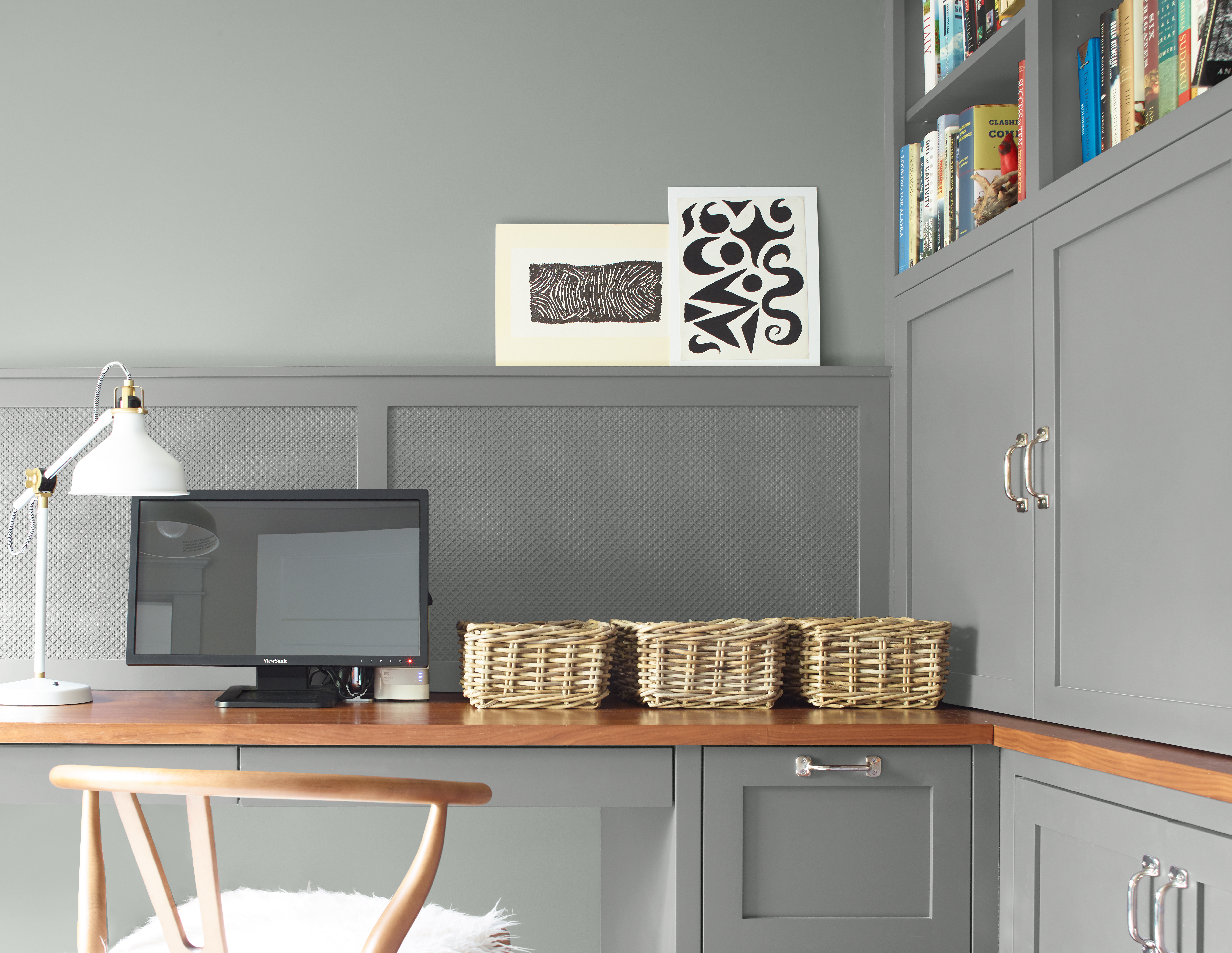 Home office with Benjamin Moore Metropolitan gray wall paired with cooler gray cabinetry