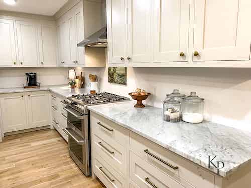 Kitchen cabinets in BM Revere Pewter. Design by Kayla Payne Design