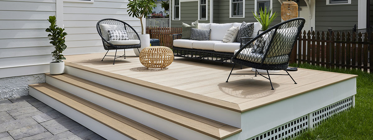 Small Outdoor Space with a low deck built in TimberTech decking, Weathered Teak Vintage Collection