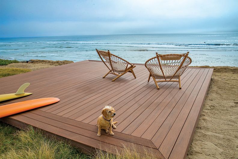 Floating deck with picture frame edge made from Timbertech Advanced PVC by AZEK in Mahogany