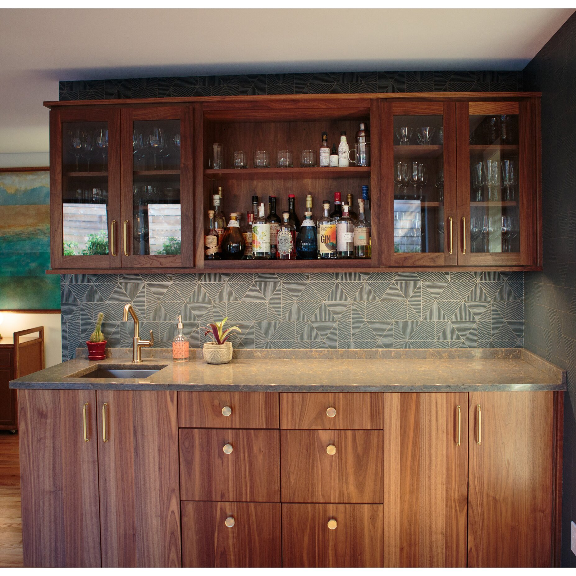 Midcentury modern wet bar with Baldwin brass cabinet pulls and knobs