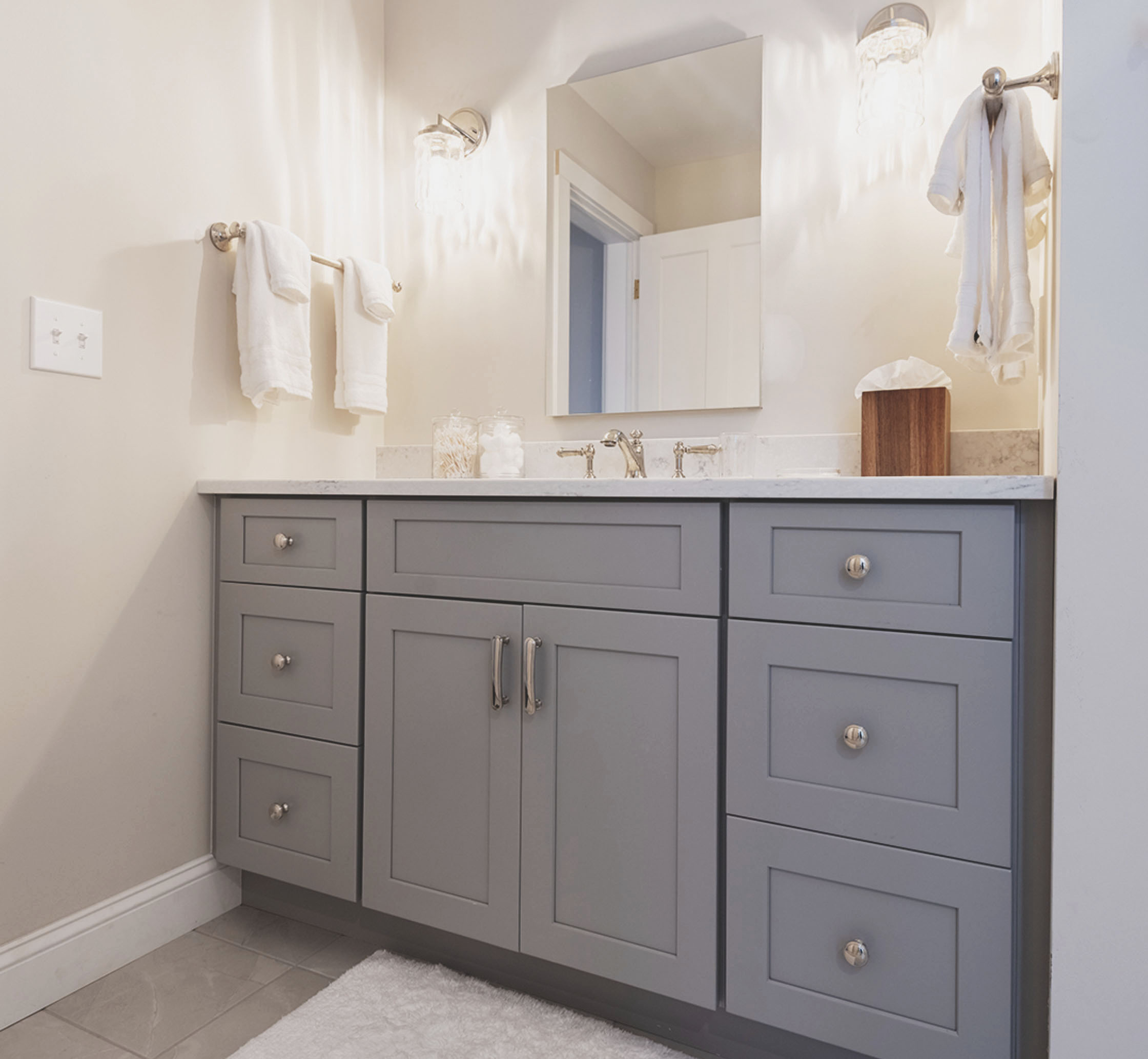 Bathroom double gray cabinets and Baldwin nickel cabinet knobs and pulls