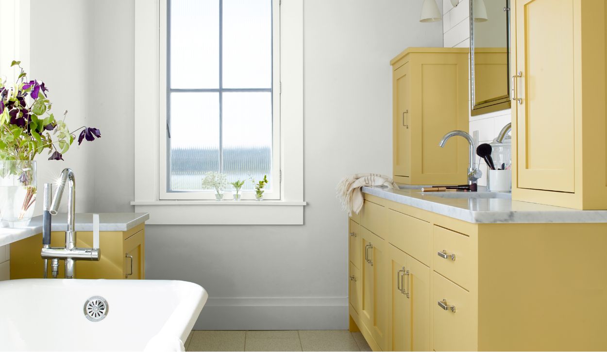 Bathroom cabinets painted in Benjamin Moore ADVANCE, Marblehead Gold HC-11, Satin