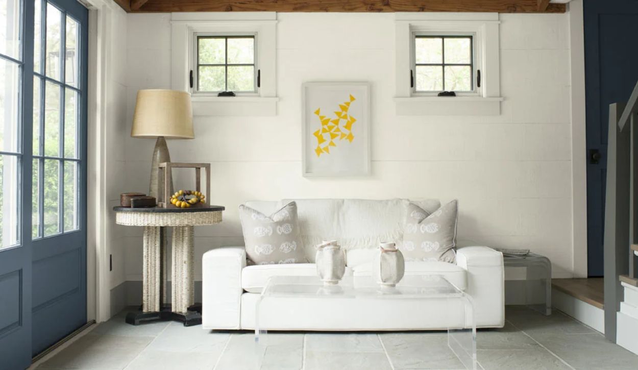 Family room with Benjamin Moore Simply White walls, door in Wolf Gray, and trim in Moonlight White