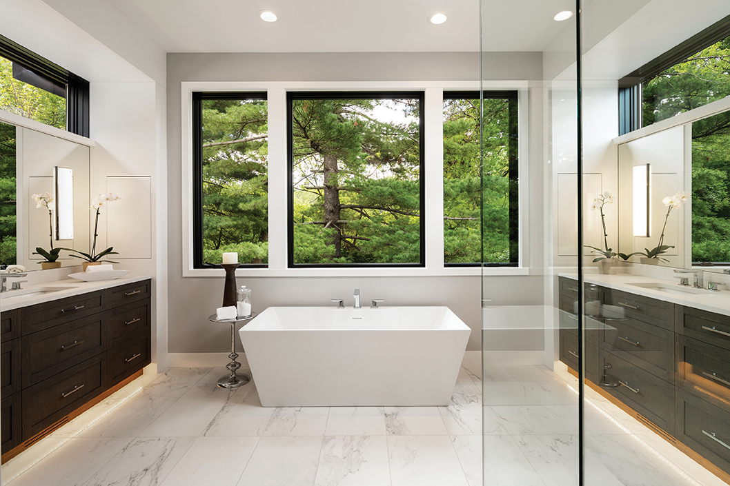 Modern bathroom featuring Marvin Elevate casement windows on either side of a picture window