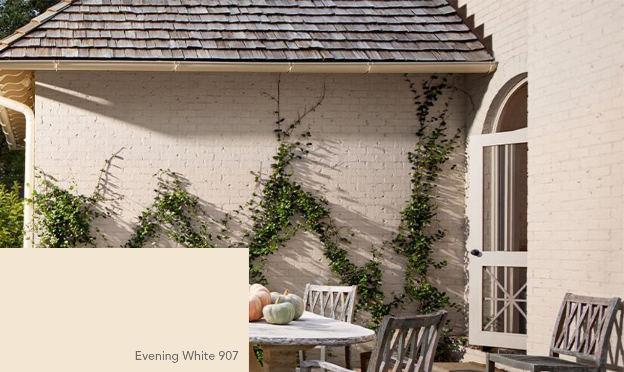 Brick house painted in Benjamin Moore Evening White