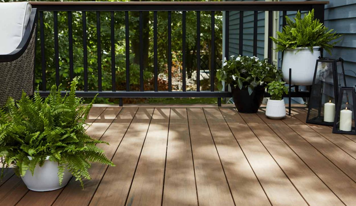 Mahogany decking from the TimberTech Advanced PVC Vintage Collection with a Classic Composite Series Drink Rail