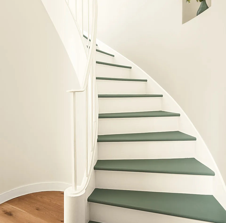 Staircase with Benjamin Moore Sea Salt CSP-95 on the walls