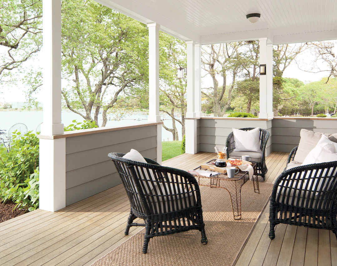 Wood deck and railings stained in Benjamin Moore Arborcoat Translucent Classic Oil Stain Silver Gray