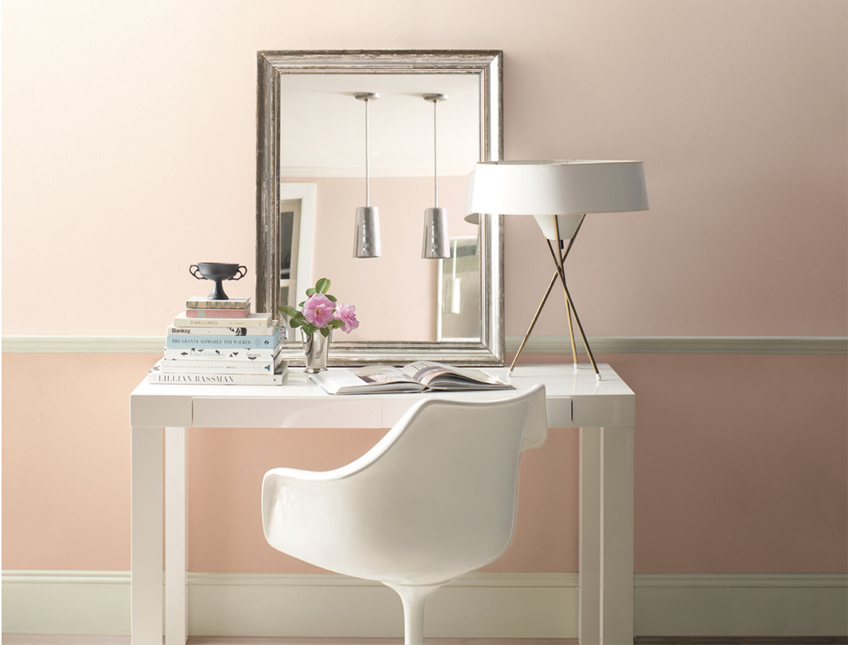 Home office desk with Benjamin Moore Touch of Pink on upper wall and and Sunlit Coral on lower wall