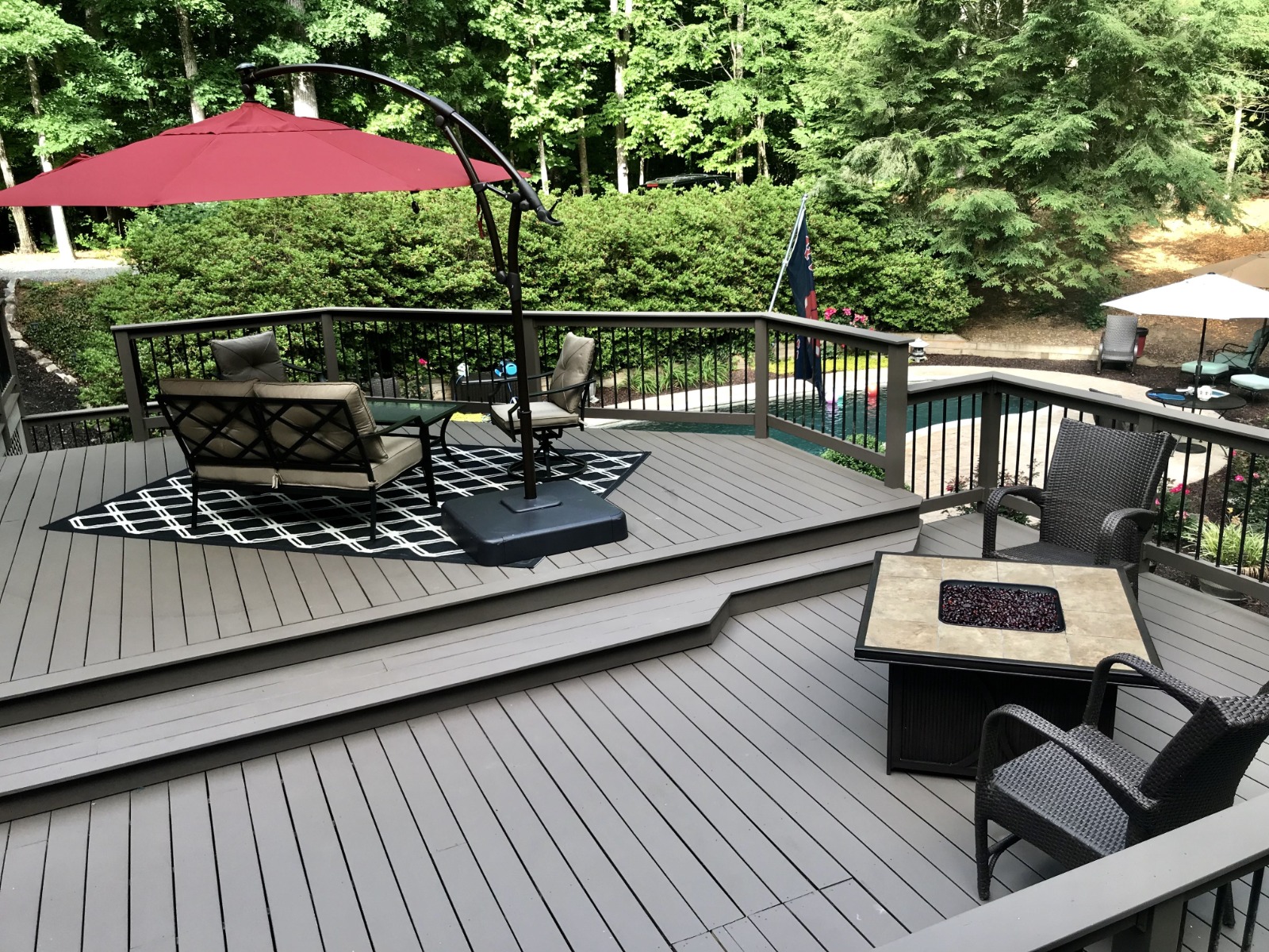 Multi-level wood deck finished in Benjamin Moore Arborcoat Solid Stain in Spanish Moss