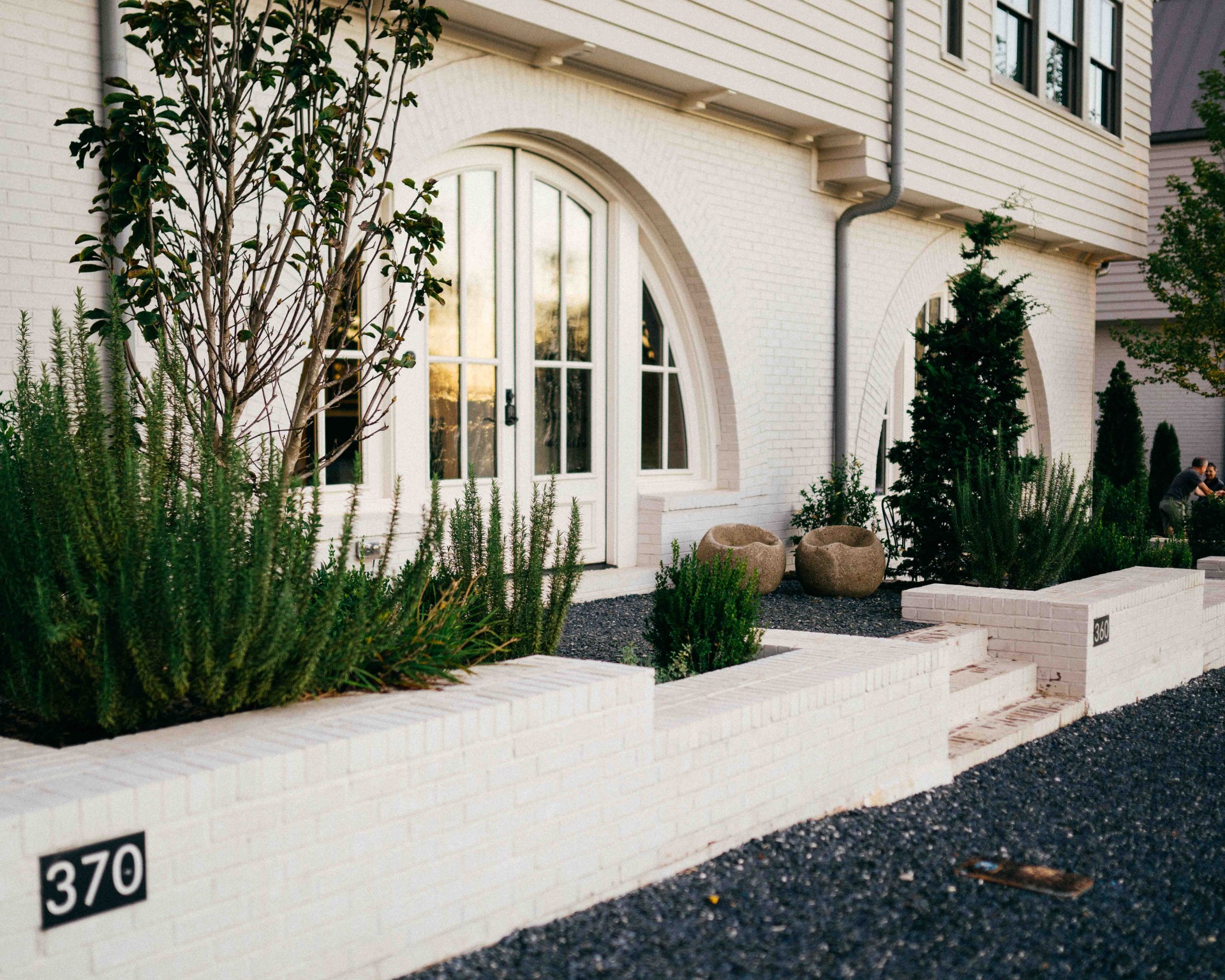 Brick house painted with white masonry flat paint